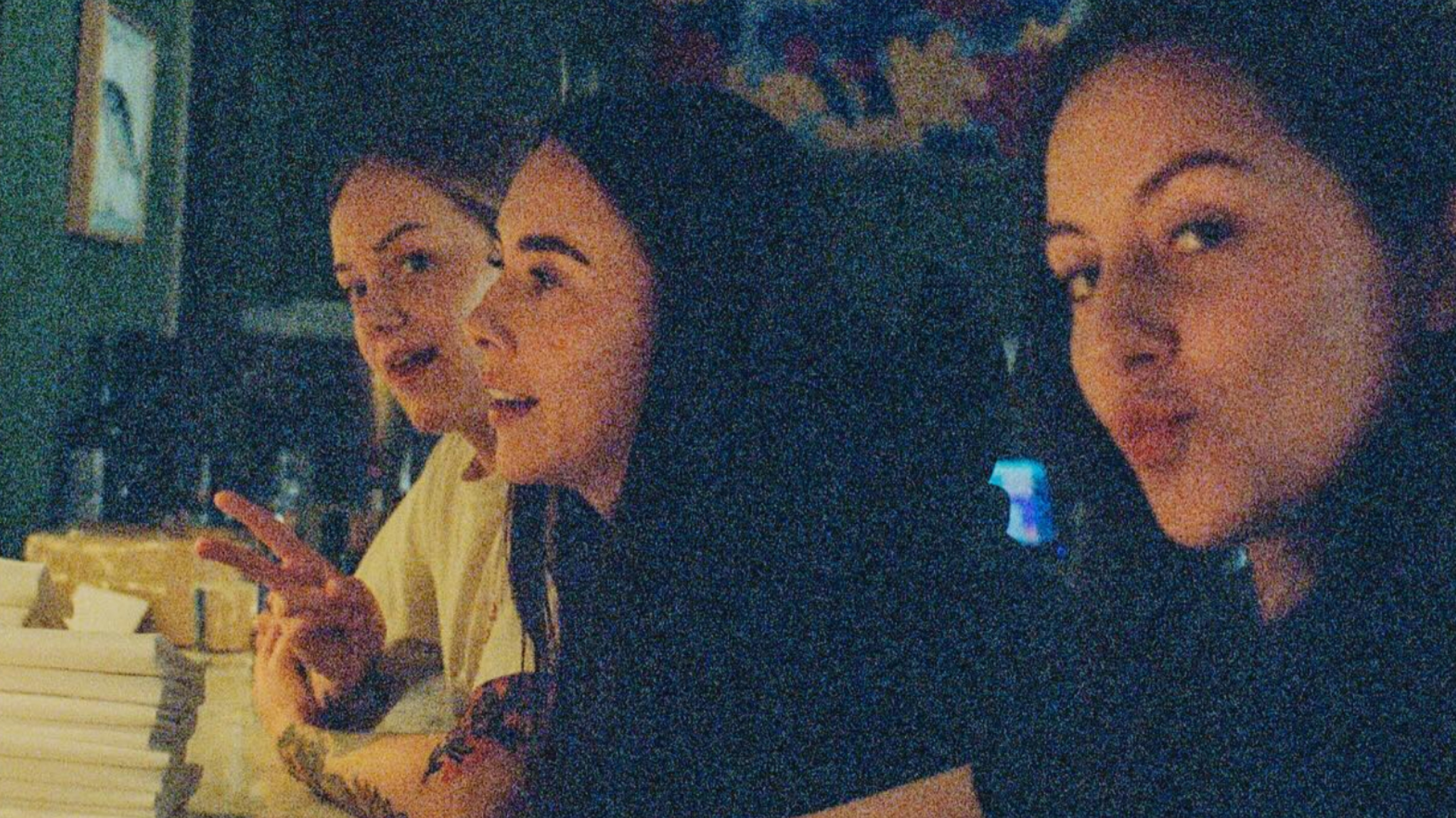 Friends talking at a candlelit table