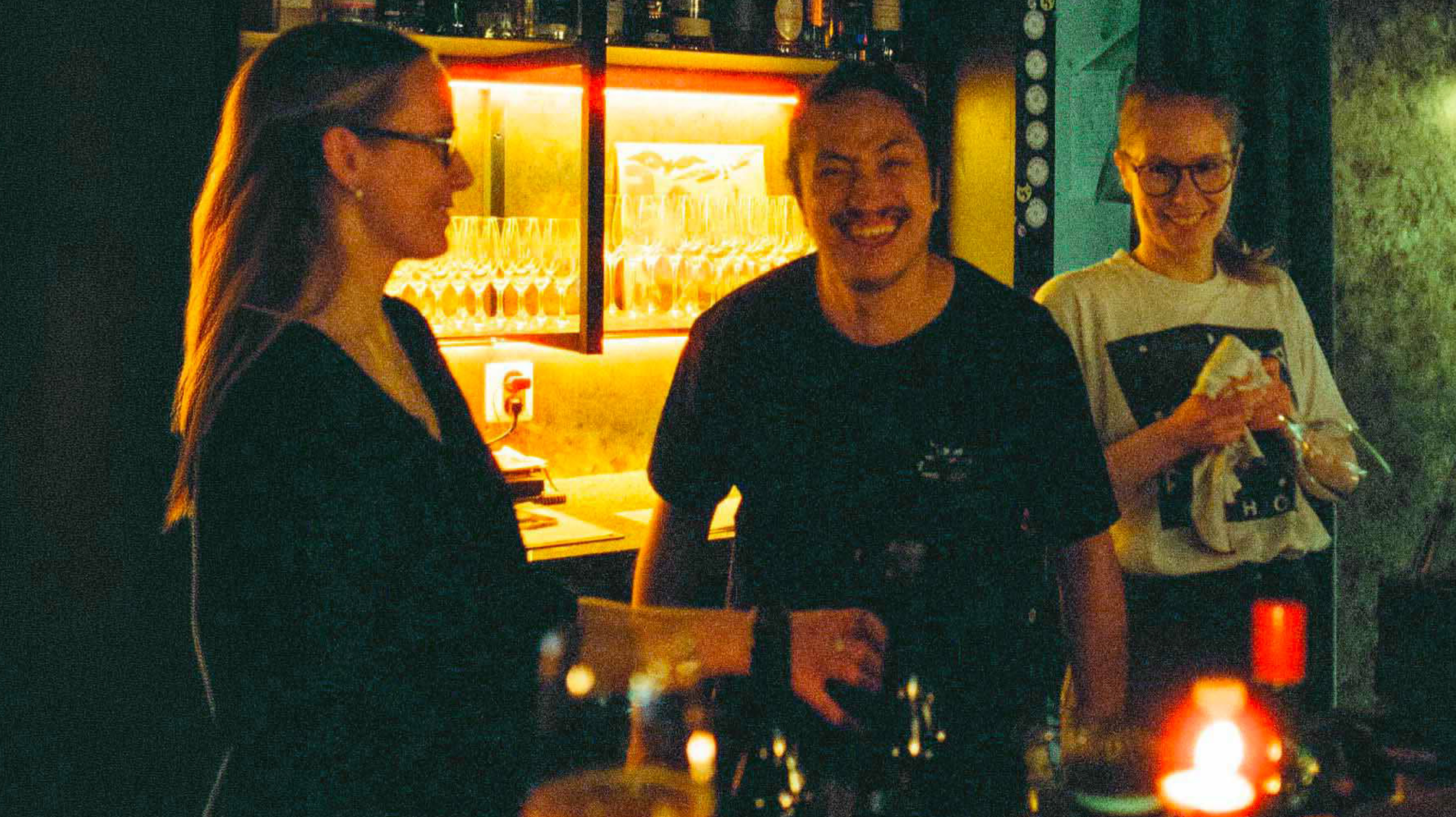 Staff laughing behind the bar